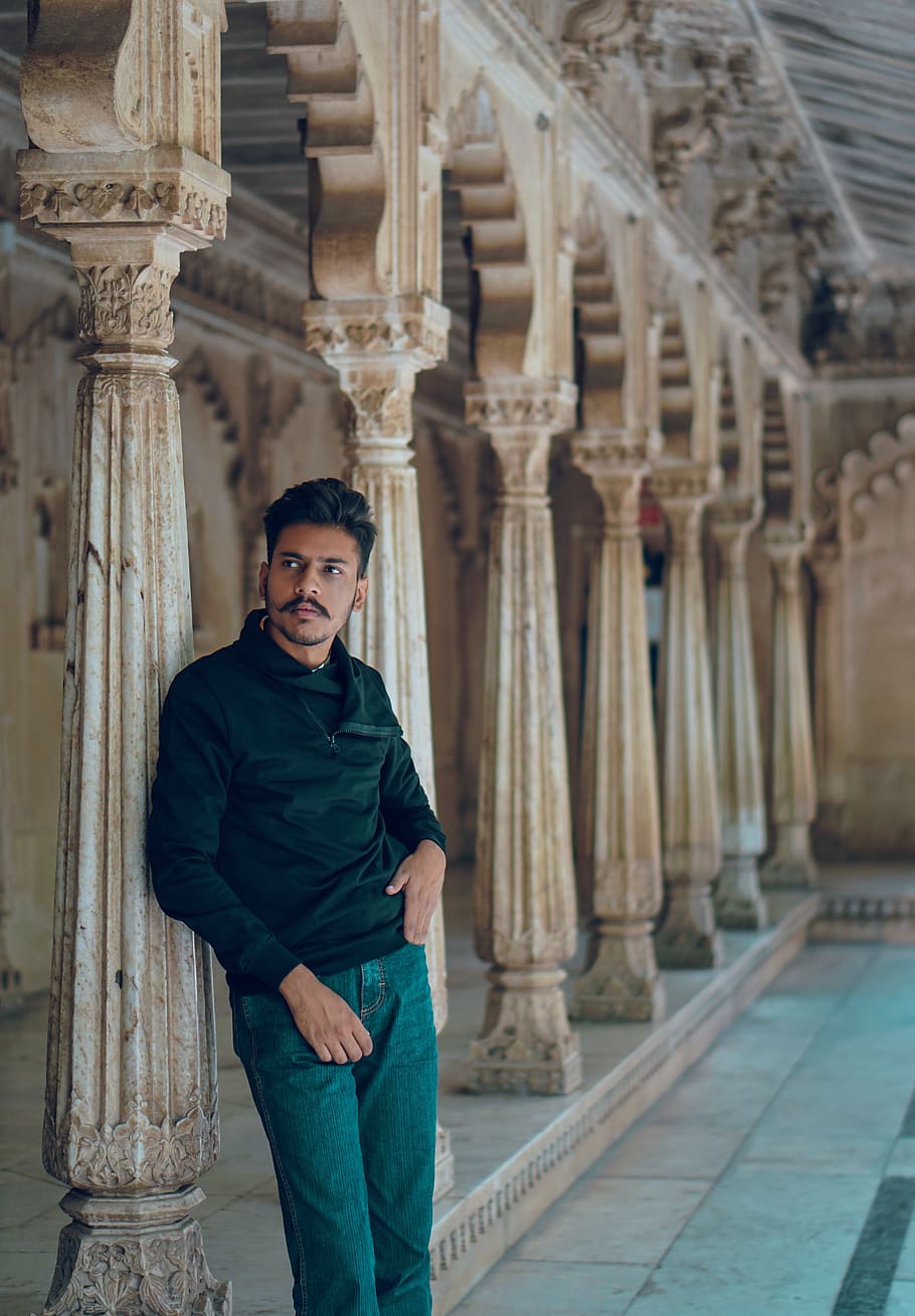 Man Leaning on Post, arches, architecture, building, columns HD wallpaper