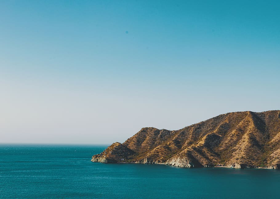 brown mountain facing ocean, promontory, outdoors, cliff, nature HD wallpaper