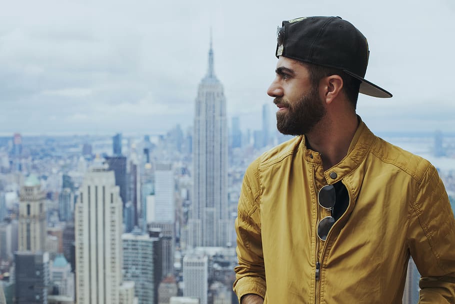 Portrait Photo of Man in Yellow Zip-up Jacket Near Empire State Building HD wallpaper