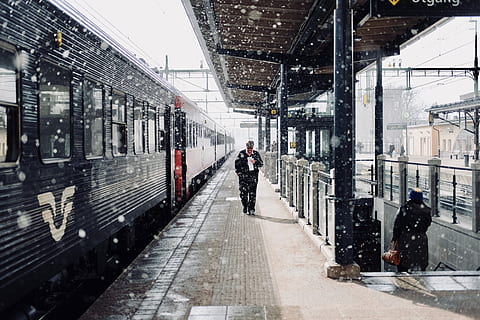 Man Walks Beside Train, building, commuters, daylight, daytime HD wallpaper