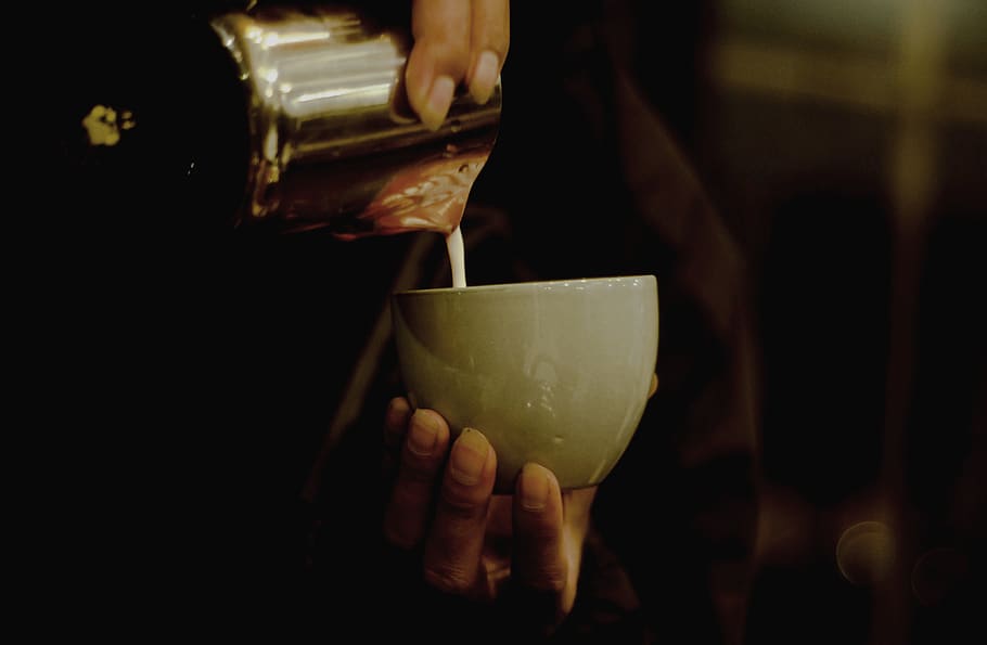 Person Pouring Liquid In Ceramic Cup, container, drink, mug, human hand HD wallpaper