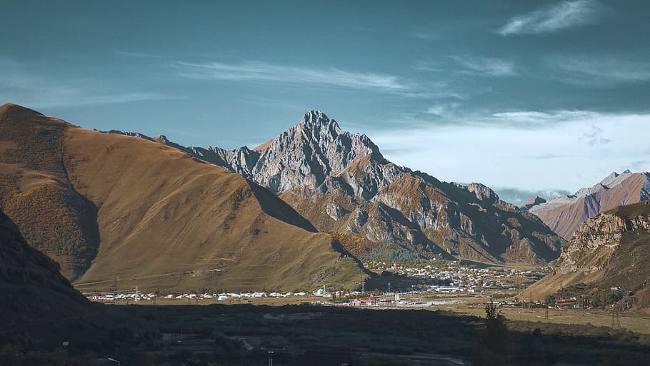 brown mountain, blue sky, rock, town, village, hike, landscape HD wallpaper