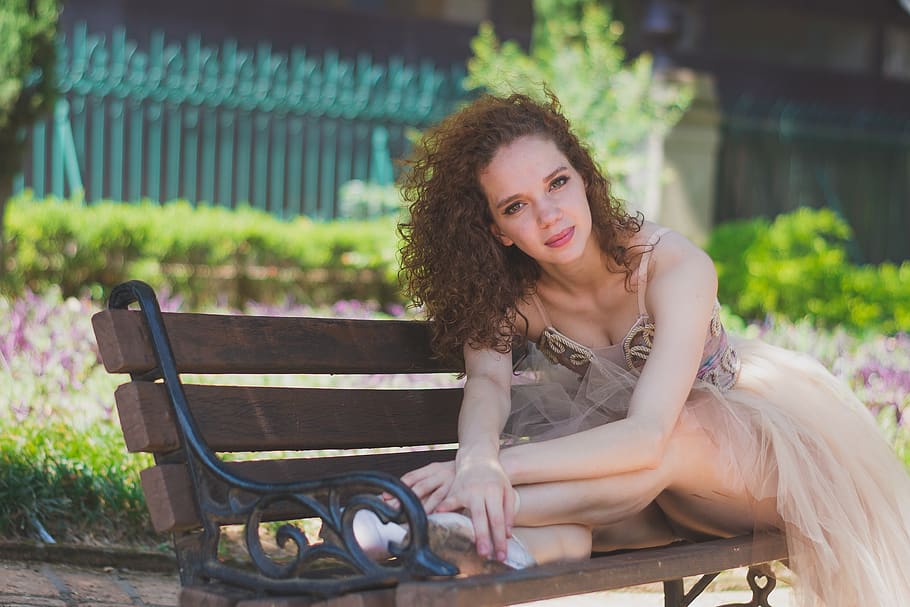 Woman Sitting on Bench, beautiful, facial expression, looking HD wallpaper