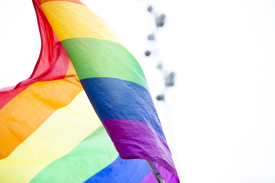 multicolored striped flag during daytime, multi colored, blue HD wallpaper