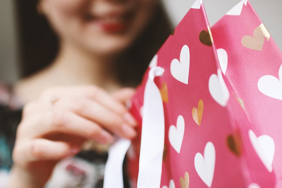 Young girl unpacking a gift. Valentine’s Day., one person, adult HD wallpaper