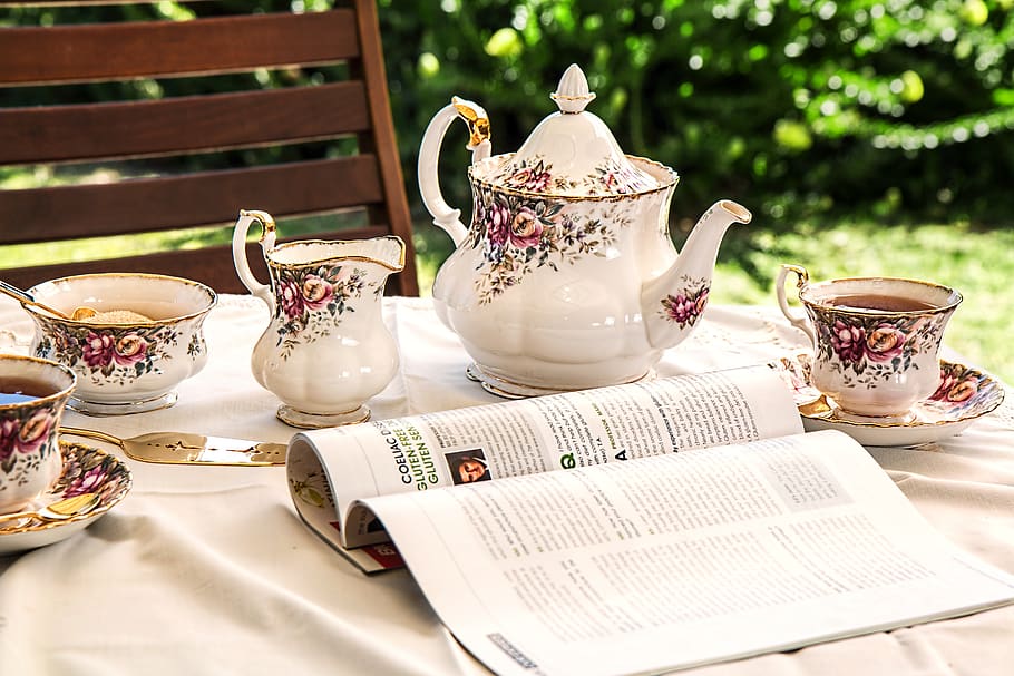 White and Pink Floral Ceramic Tea Set on White Textile Covered Table Beside White and Black Printed Book, HD wallpaper