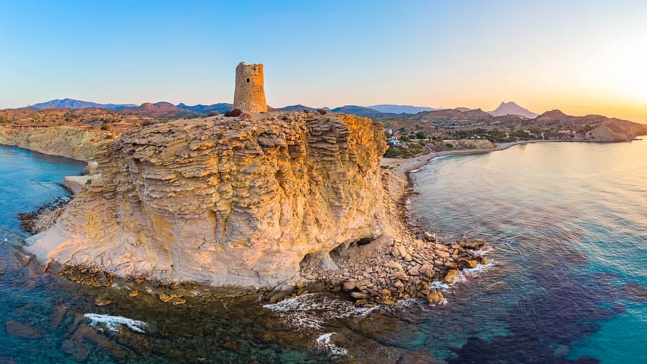 Brown Cliff Surrounded Body of Water, beach, cliff coast, clouds HD wallpaper
