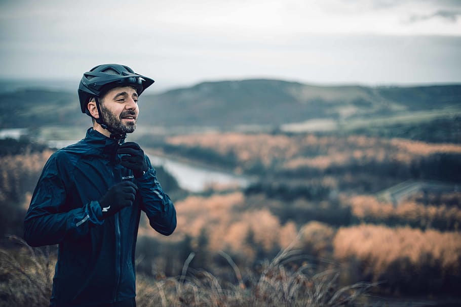 man fixing his jacket, standing, one person, mountain, leisure activity HD wallpaper