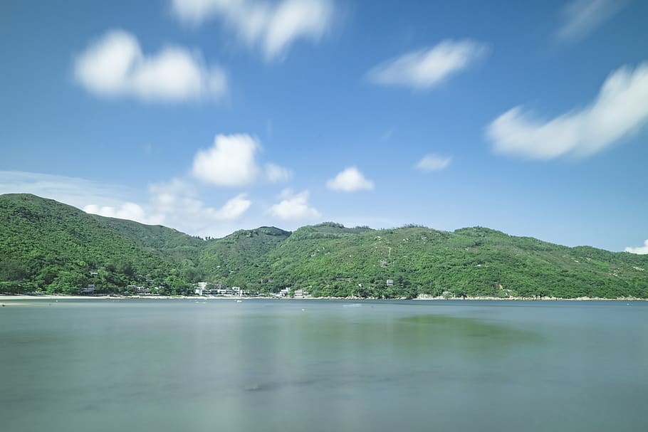 Mountain Covered Trees in Front of Body of Water, beach, clouds HD wallpaper