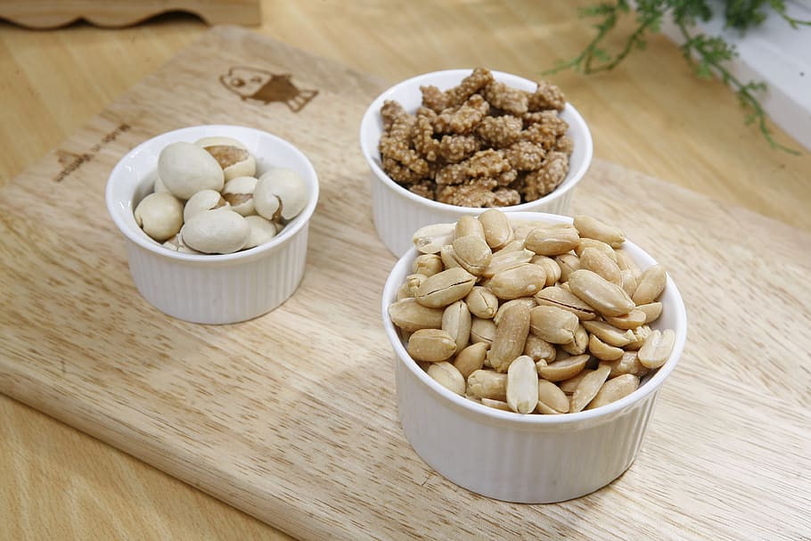 Brown Nuts on White Ceramic Bowl, peanuts, tasty, wood table top HD wallpaper