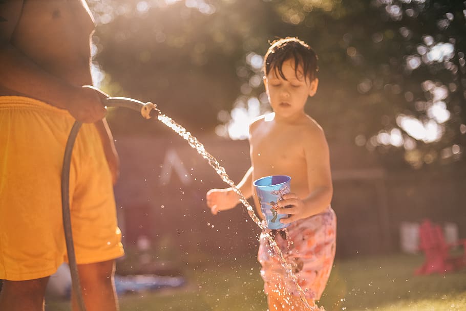 Boy Holding Blue Cup, adorable, child, enjoyment, fun, hose, kid HD wallpaper