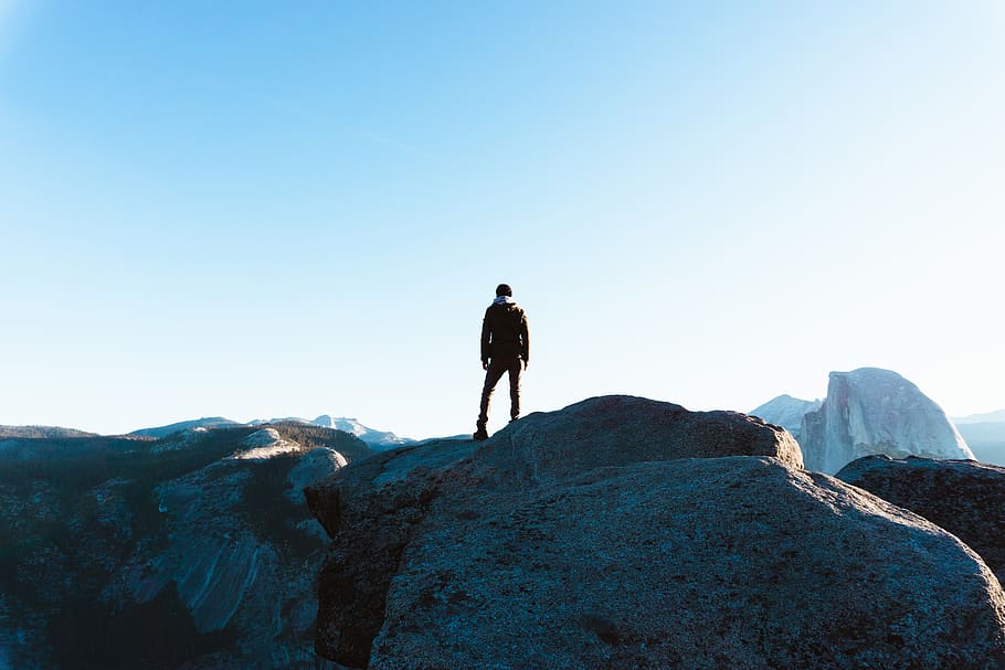 man standing on cliff, person, human, adventure, outdoors, leisure activities HD wallpaper