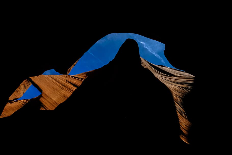 brown rock formation, studio shot, copy space, one person, black background HD wallpaper