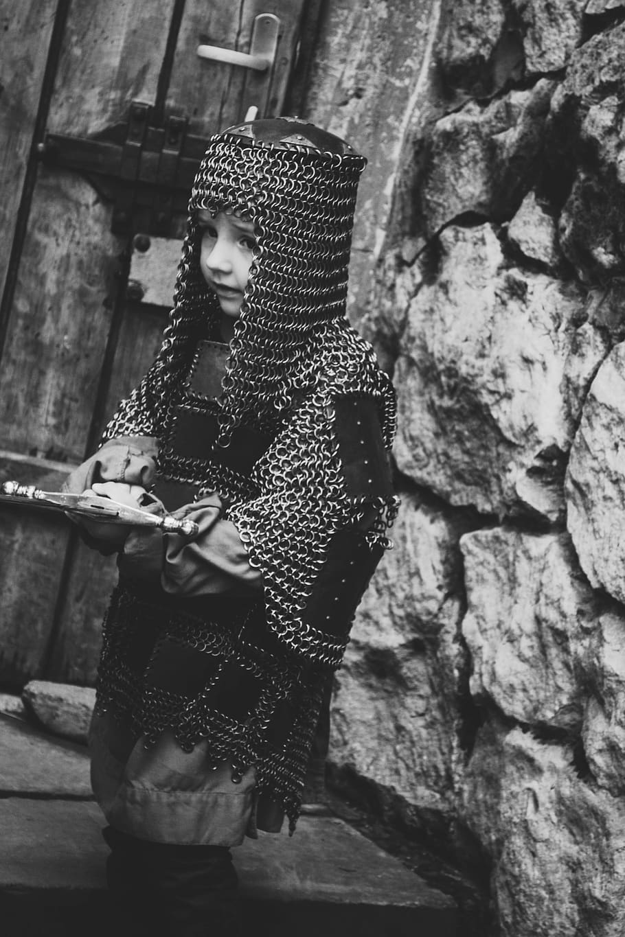 grayscale photo of child wearing chain mail, rock, sword, armor, HD wallpaper