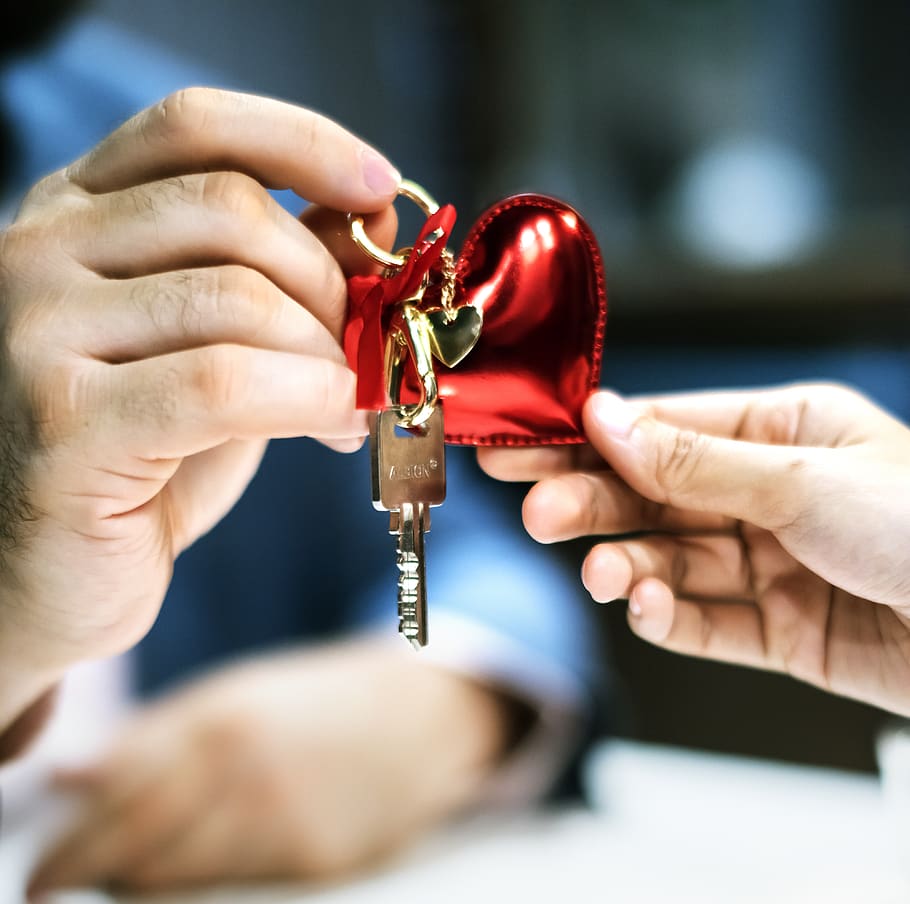 Selective Focus Photography of Two Person's Hands Holding Gray Key With Red Heart Keychain, HD wallpaper