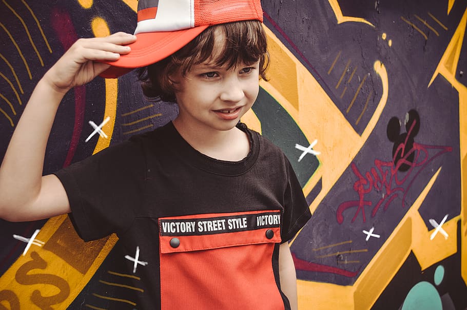 Boy Wearing Fitted Cap While Standing Beside Graffiti, child HD wallpaper