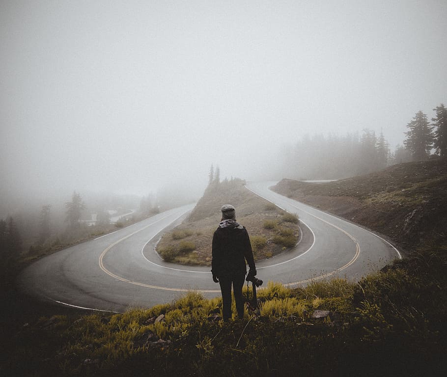 person, camera, road, mist, fog, cloud, bend, road trip, grass HD wallpaper