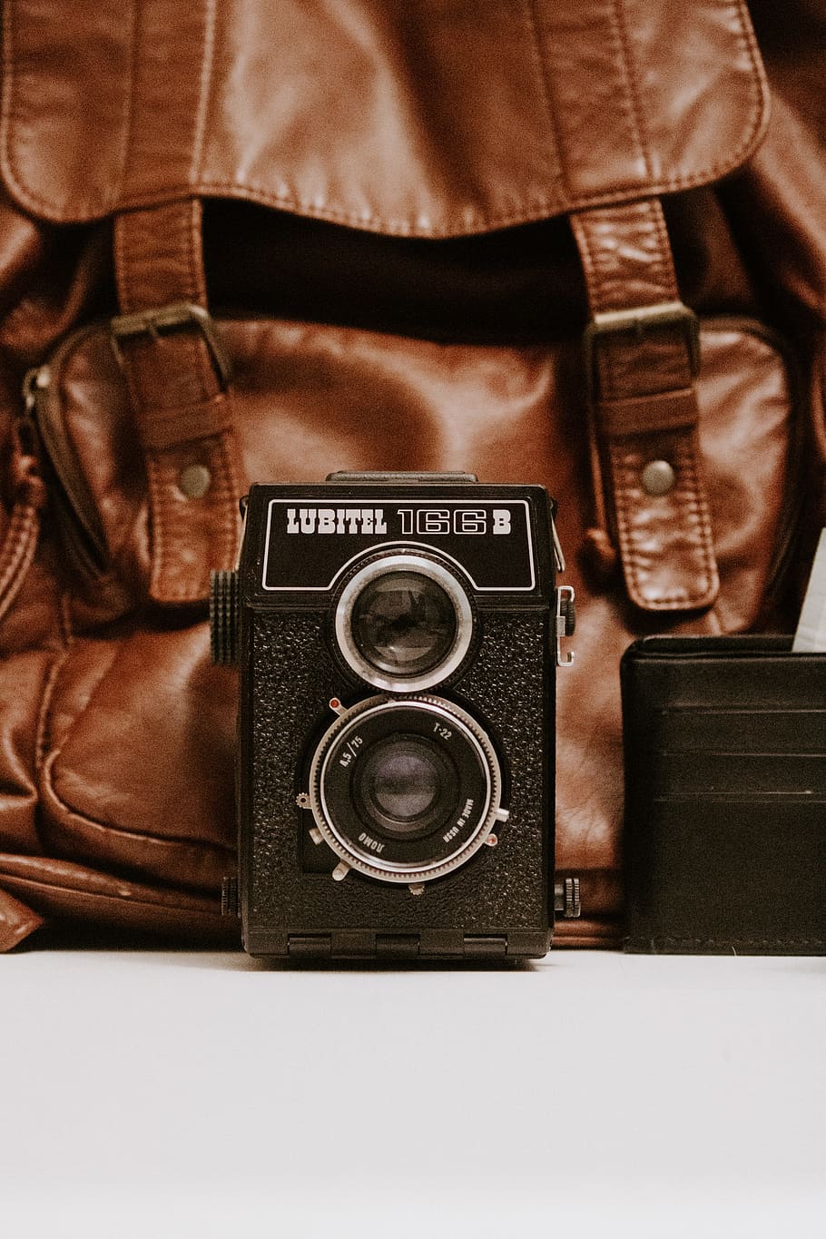 black Lubitel camera and brown leather bag, wallet, lomography HD wallpaper