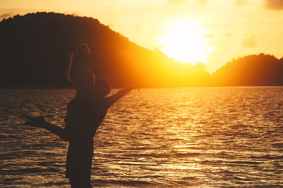 sunset, ocean, sea, island, trees, people, guy, girl, couple HD wallpaper