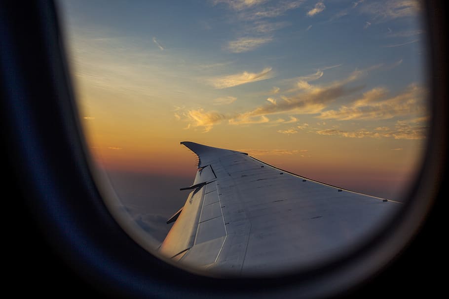 airplane wing through window, sky, sunset, sunrise, cloud, horizon