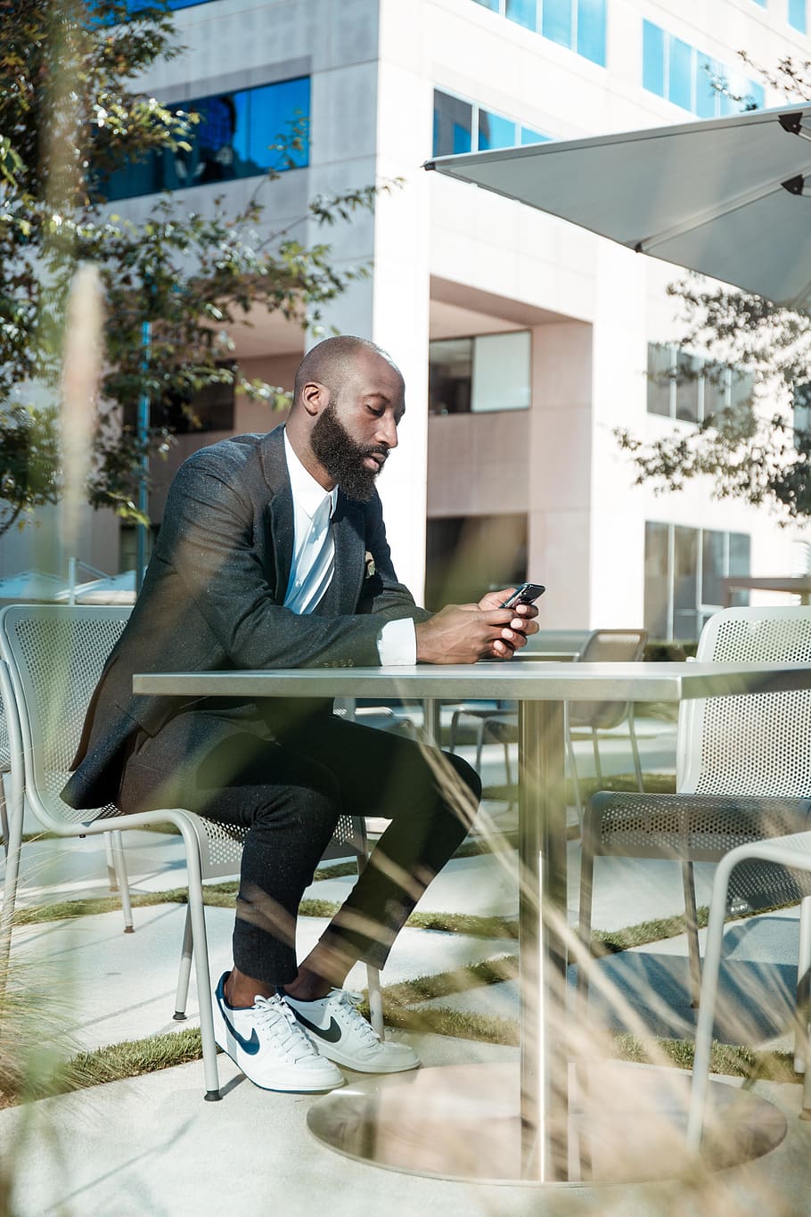 man looking at phone, furniture, chair, clothing, footwear, shoe HD wallpaper