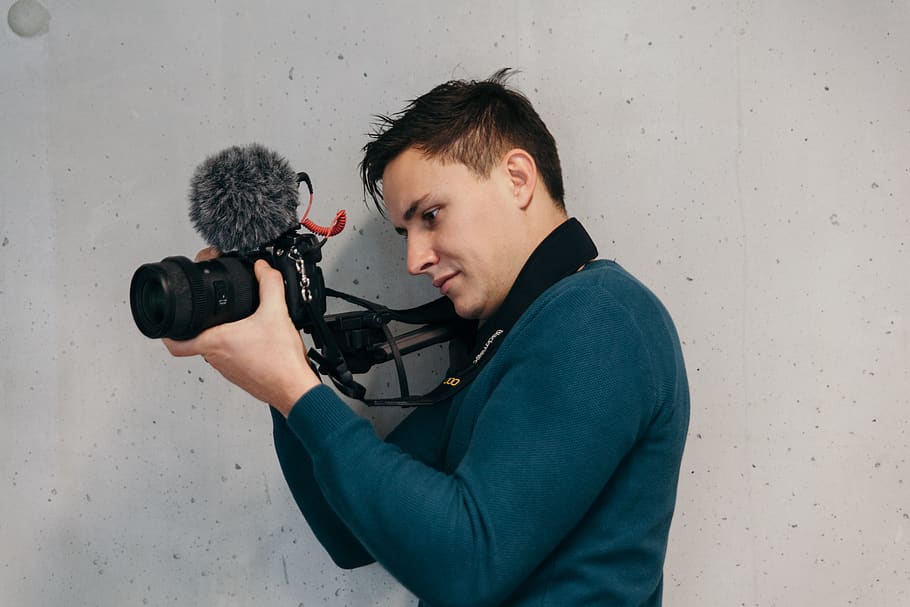 man in blue sweater using DSLR camera, one person, photography themes HD wallpaper