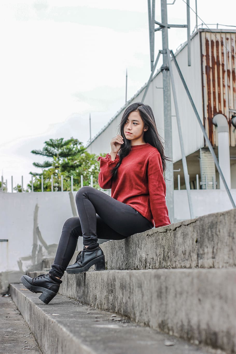 Photo of Woman Sitting on Concrete Stairs Posing, beautiful woman