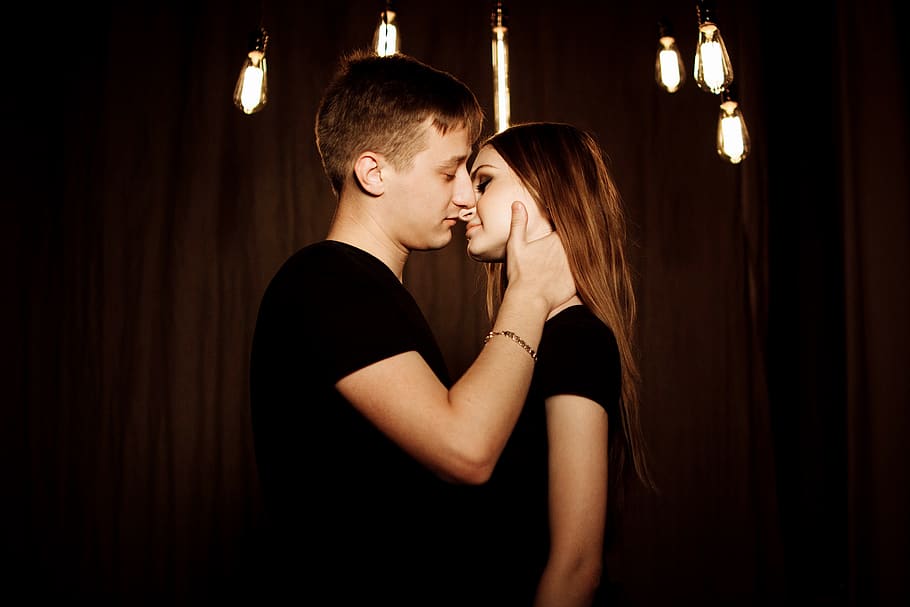 Young Couple Kissing at Night, female, lights, love, man, people, HD wallpaper