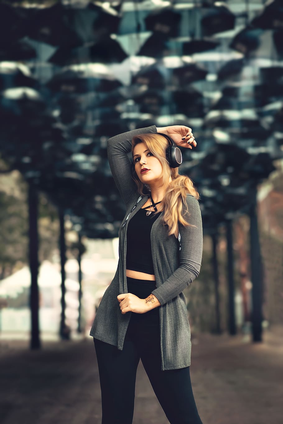 Woman Wearing Headphones Standing Under Tunnel, attractive, beautiful