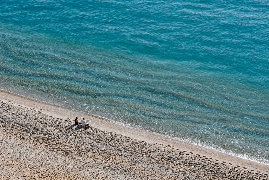 two people sitting on shore, beach, water, sea, land, sand, beauty in nature HD wallpaper