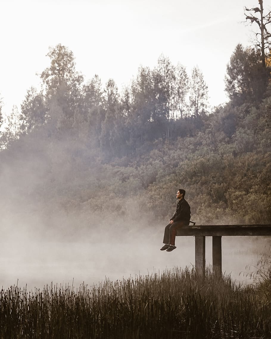 man sitting on boardwalk, nature, human, person, weather, outdoors HD wallpaper