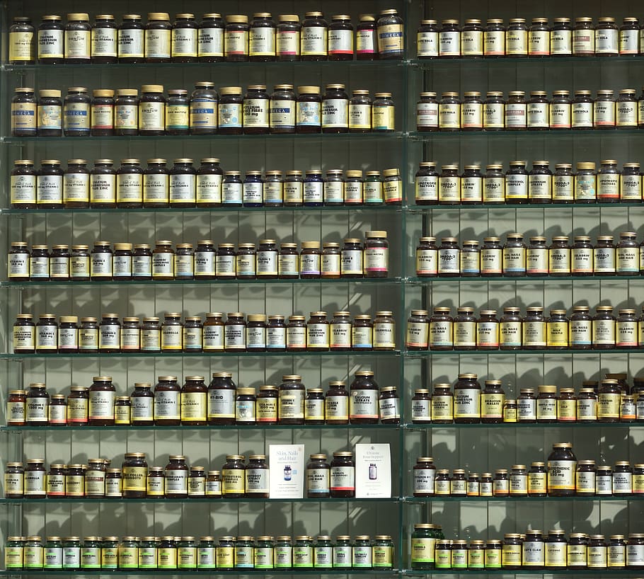assorted labeled bottle on display shelf, large group of objects HD wallpaper
