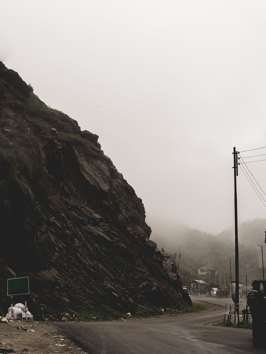 mountain beside electric post, nature, outdoors, cliff, fog, road HD wallpaper