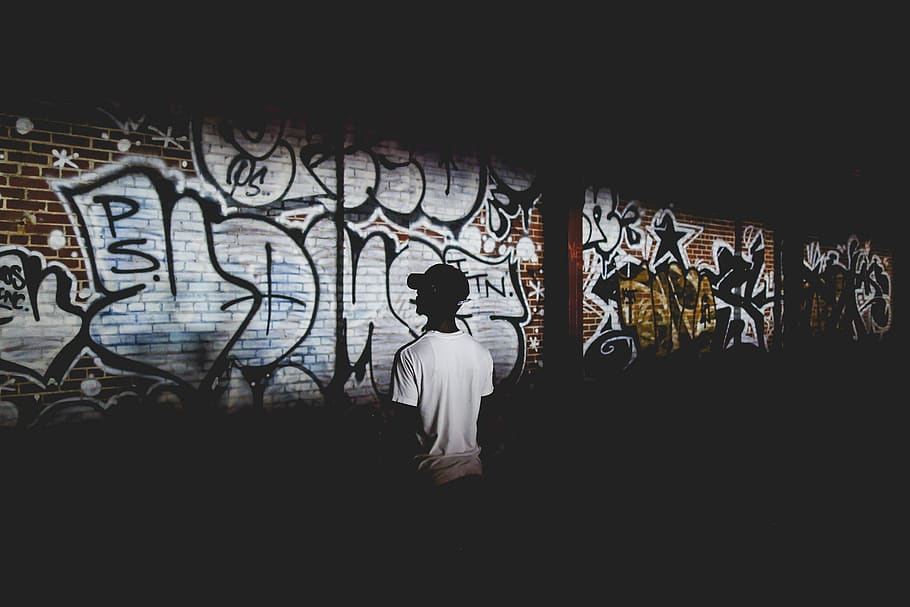man standing beside wall with graffiti text, person, human, art HD wallpaper