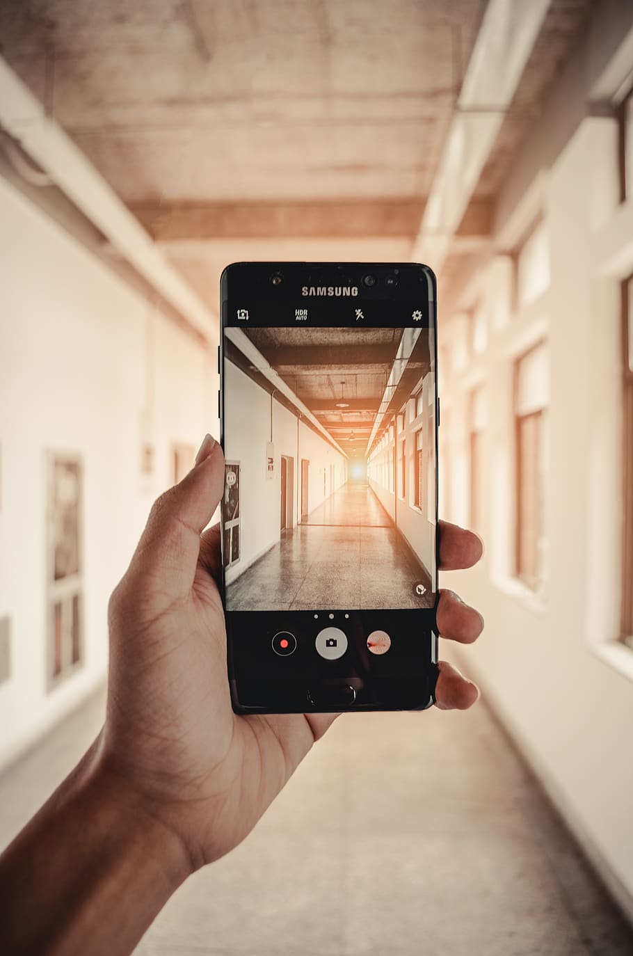 black Samsung Android smartphone, corridor, electronics, human hand HD wallpaper