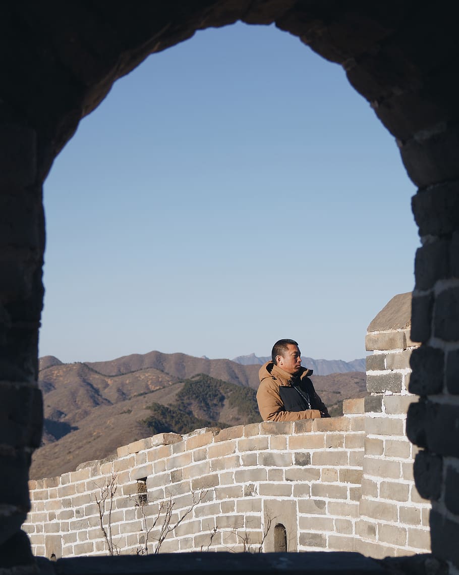 man leaning on wall, human, person, brick, building, architecture HD wallpaper
