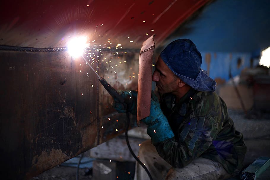 Man Holding Welding Rod and Welding Mask While Working, job, person
