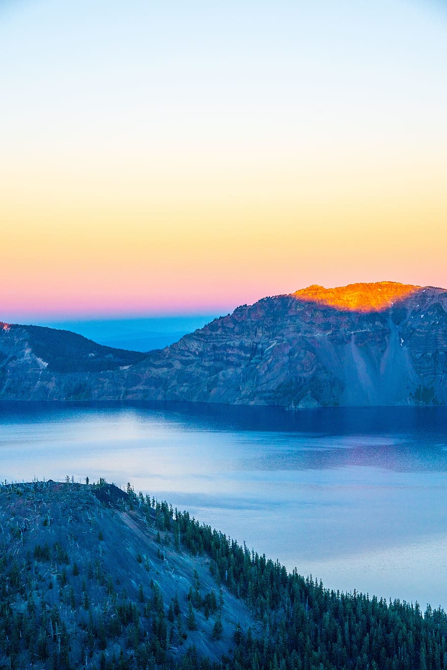brown rocky mountain surrounded by lake taken at daytime, sky HD wallpaper