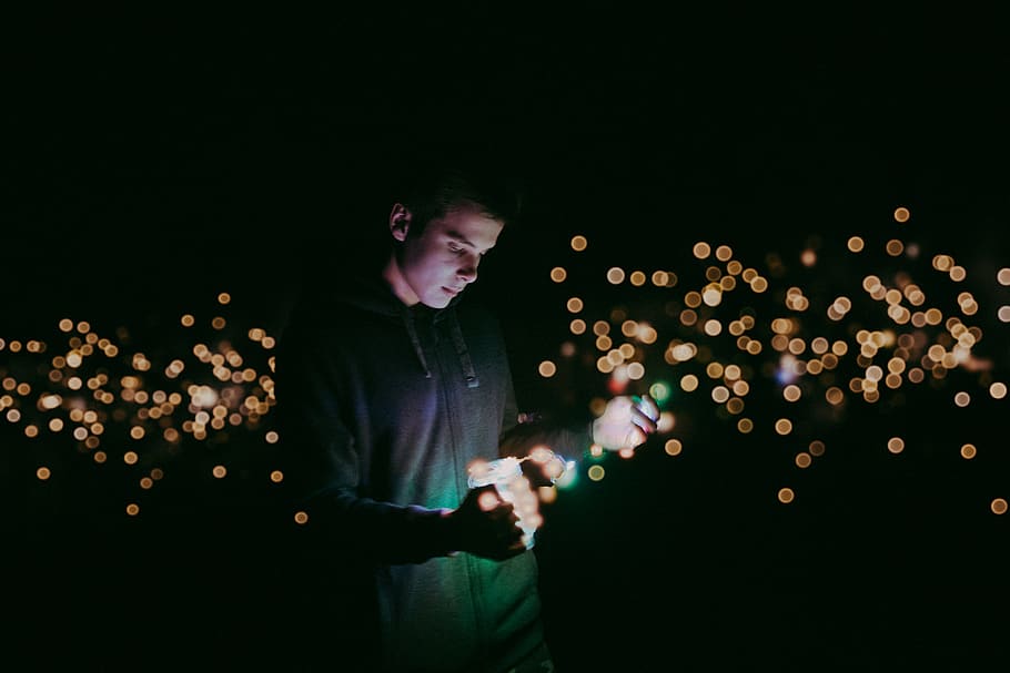 man standing while wearing black zip-up jacket, lighting, person HD wallpaper