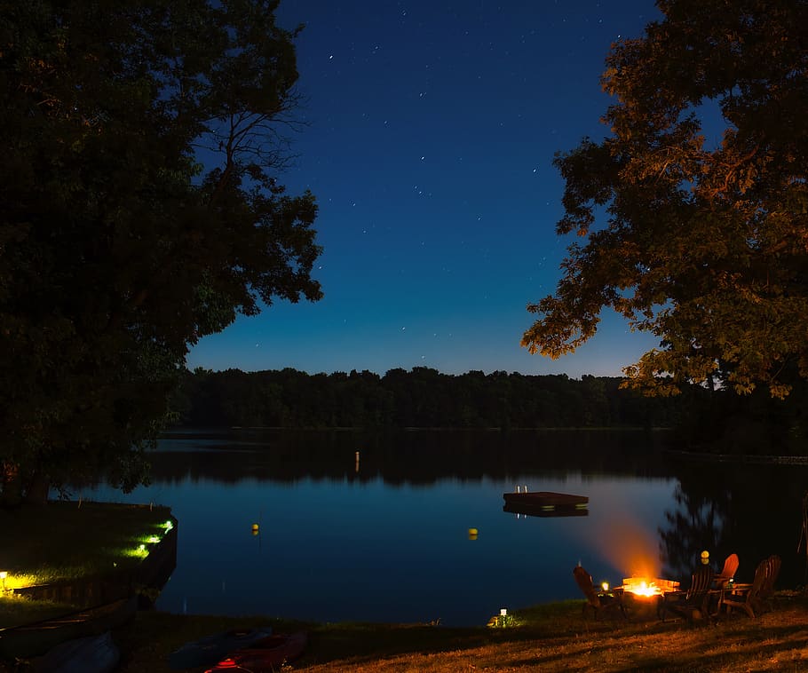 Sea Body of Water Near Trees during Nighttime, bonfire, chairs HD wallpaper