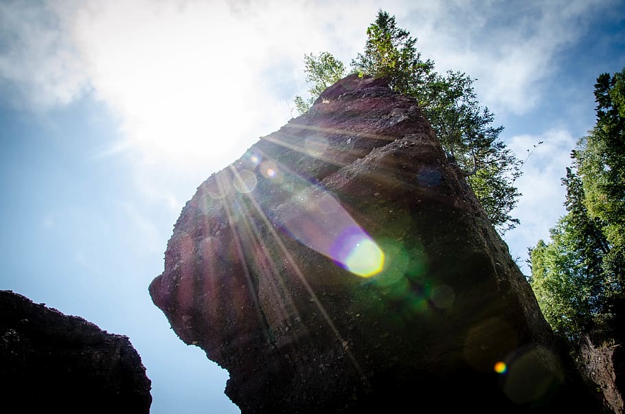 canada, new brunswick, sun, rays, boulder, trees, light, rock HD wallpaper