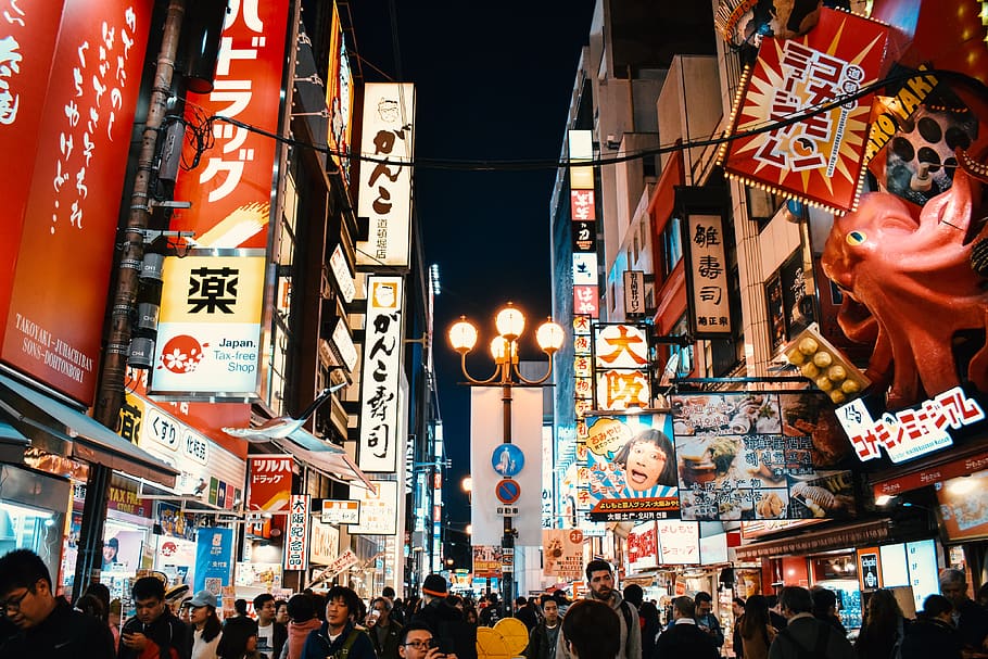 people standing between buildings at night, osaka, japan, city