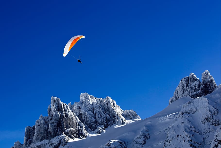 person paragliding above snow covered mountain during daytime, HD wallpaper