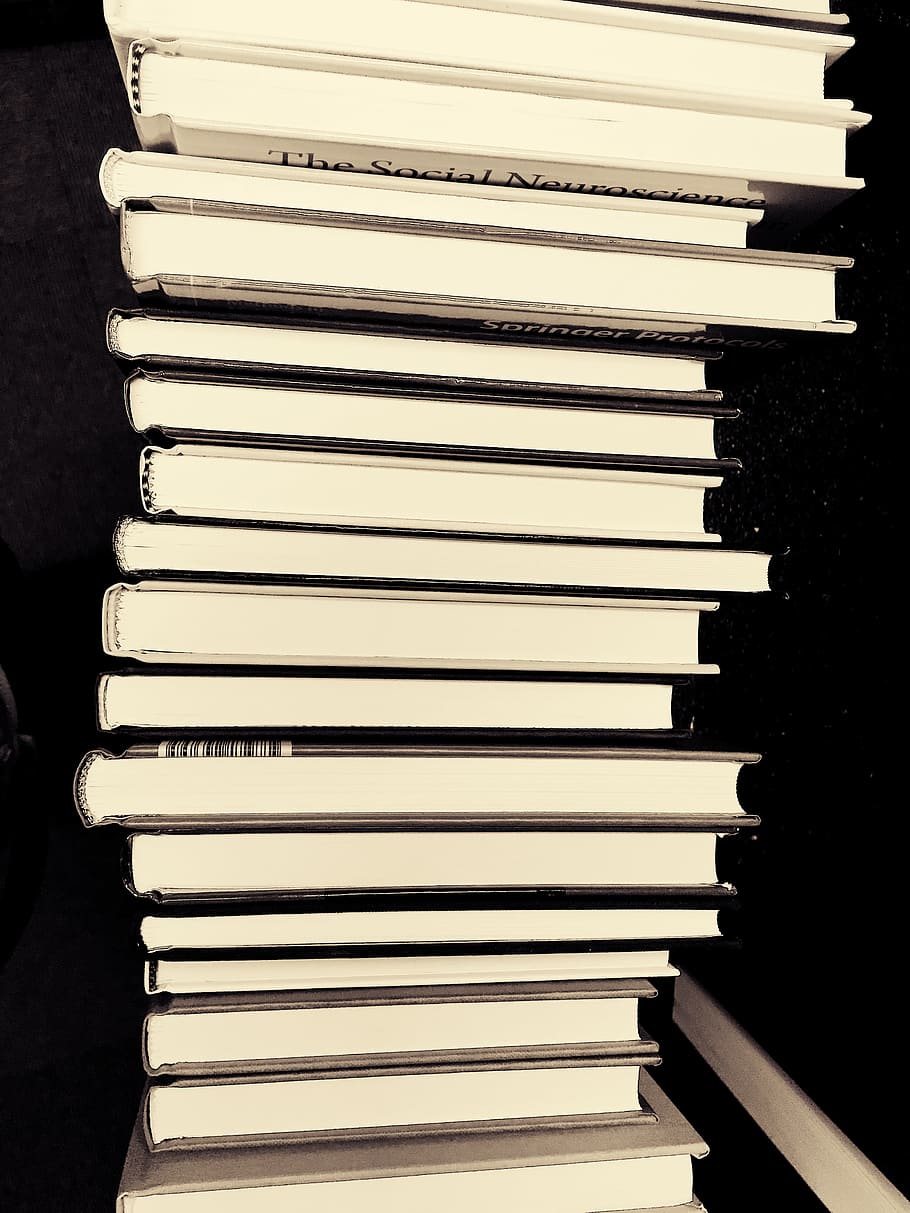 tall stack of books black and white