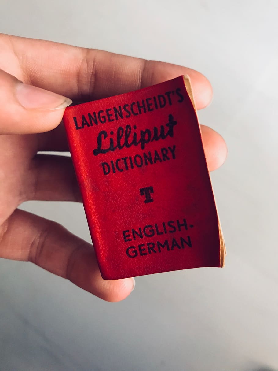 small, mini, german, book, red, tiny, miniature, little, human hand HD wallpaper