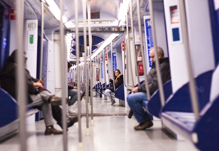 man sitting on train seat, transport, color, stranger, person HD wallpaper