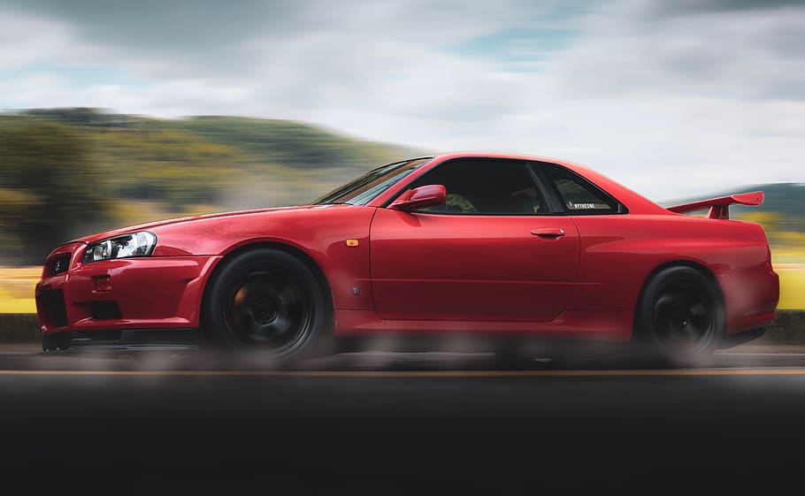 Selective Focus Photography of Red Nissan Gt-r R34 Skyline Running on Road, HD wallpaper