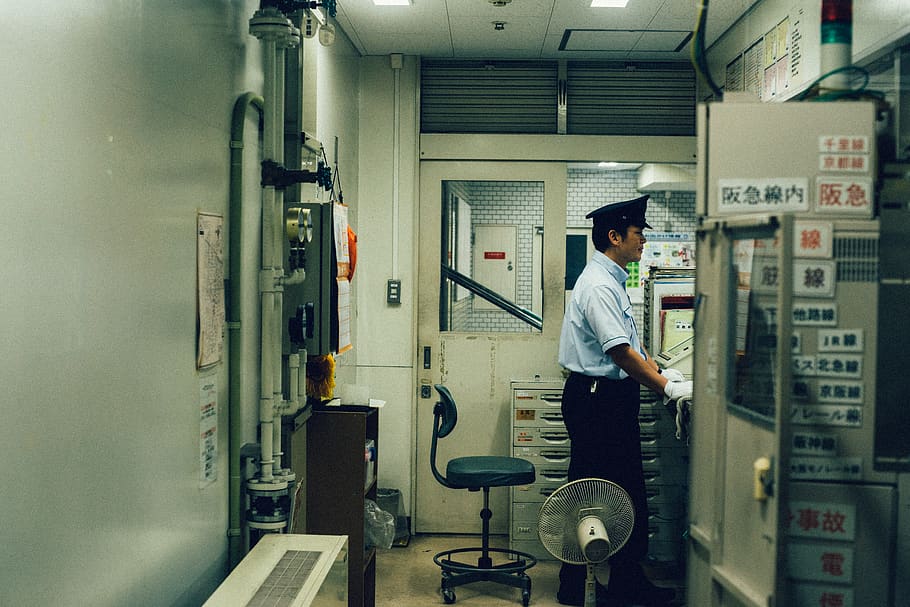 man standing near the control panel, one person, real people HD wallpaper