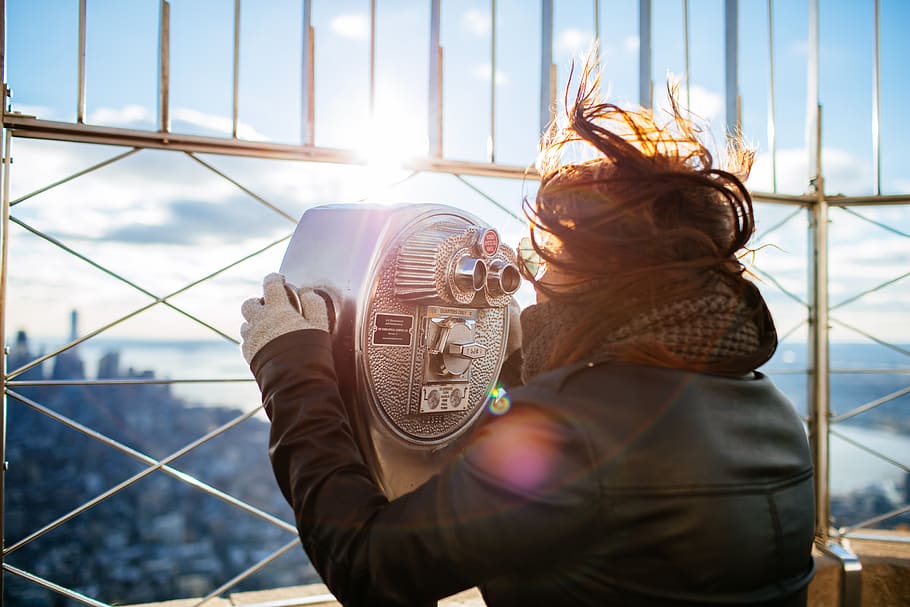 woman using gray building binoculars, real people, one person HD wallpaper
