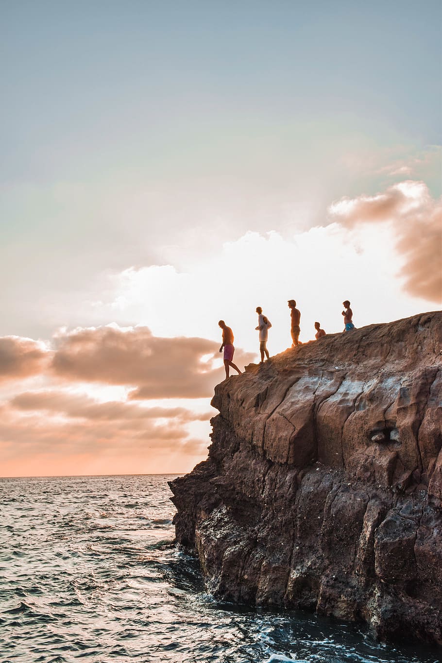 People Jumping On Body Of Water, cliff, dawn, daylight, ocean HD wallpaper